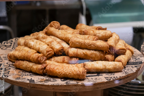 Turkish fried feta rolls on a tray in a Turkish bakery. delicious national pastries Turkish cuisine photo