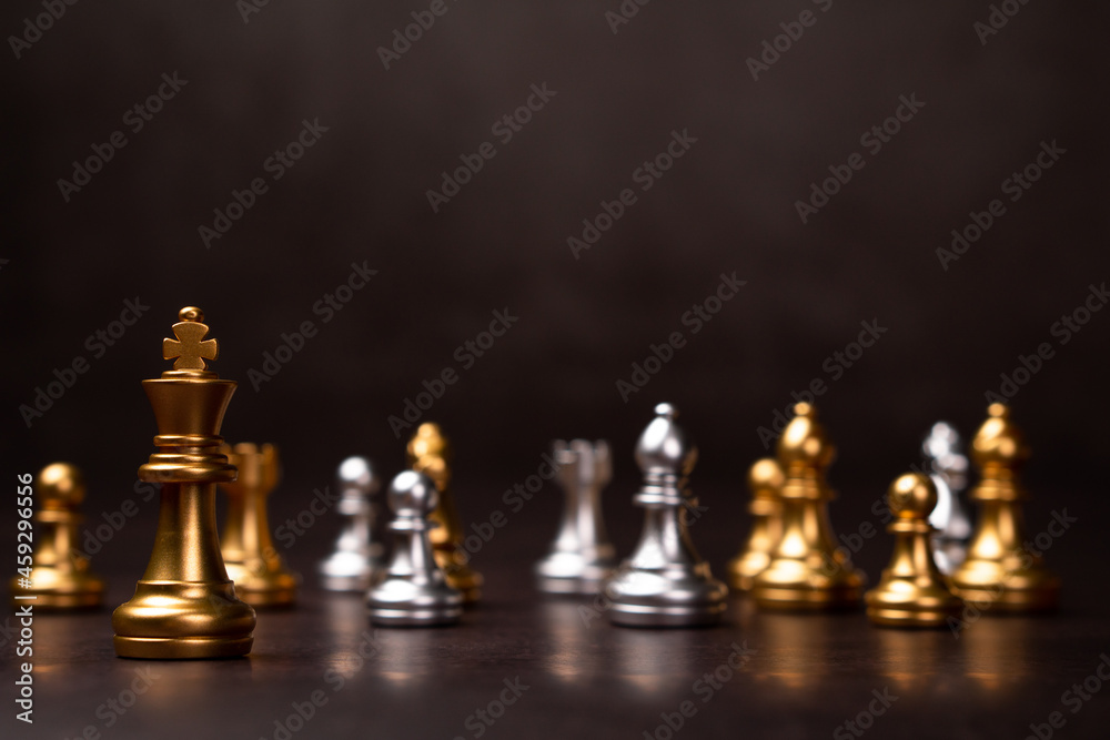 Golden Chess King standing to Be around of other chess, Concept of a leader must have courage and challenge in the competition, leadership and business vision for a win in business games Golden Chess King standing to Be around of other chess, Concept of a leader must have courage and challenge in the competition, leadership and business vision for a win in business games