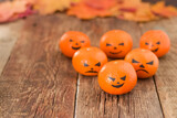 An empty space for the text. Halloween. Tangerines with painted eyes.
