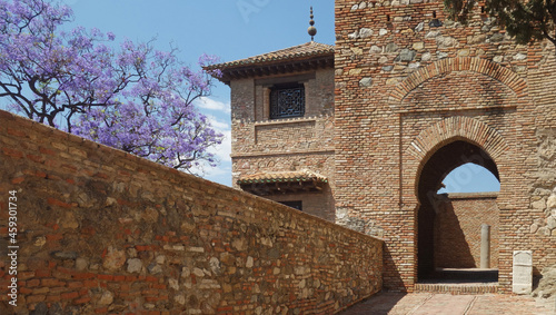 the ornate arched entrance of Alcazaba and Nascrid palace, Malaga, Andalusia, Spain  