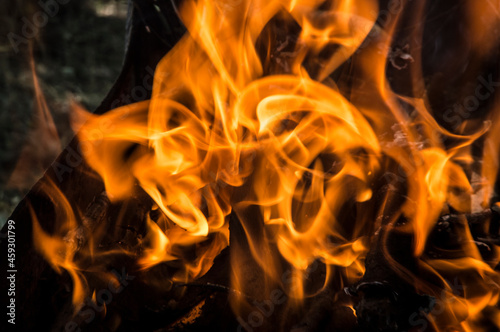 close-up: fire flames in the outdoors grill box for barbeque