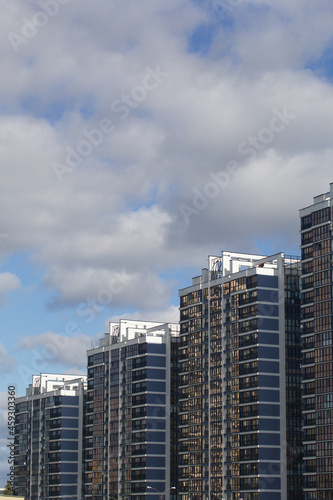 Construction of modern multi-storey buildings. Construction of a new city block. Buildings under construction are visible.