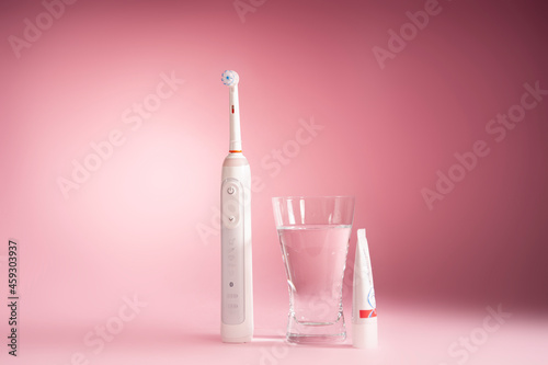 electric toothbrush on plain background