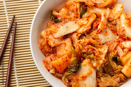 Traditional Korean Kimchi Cabbage in white bowl. Healthy food.