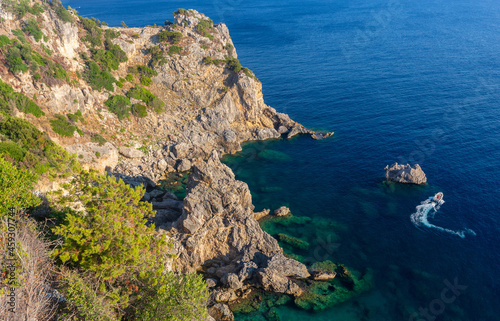 Greece. Corfu. Rocks against the background of the blue Mediterranean sea.