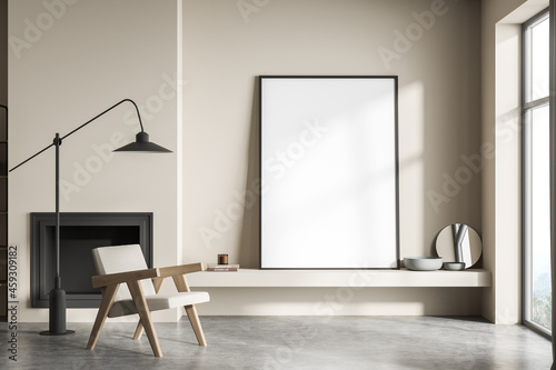 Fotótapéta Standing canvas next to beige living room wall and single armchair