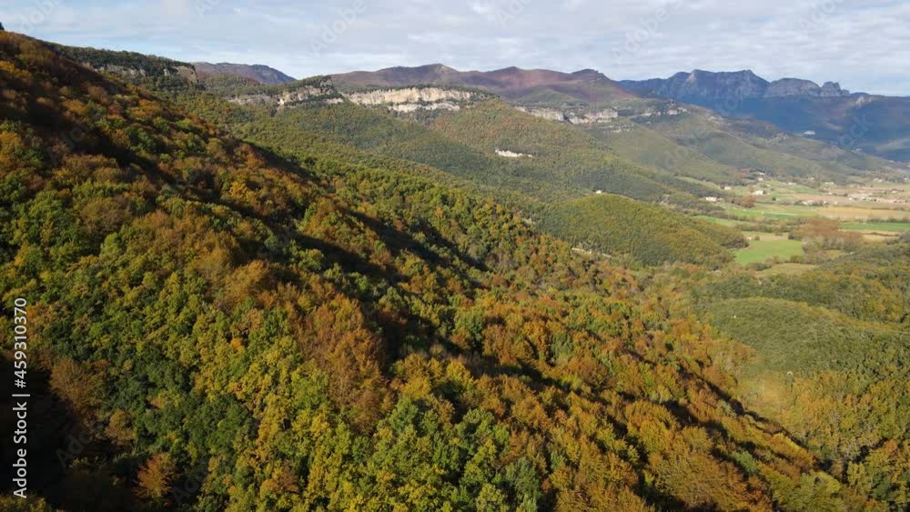 Aerial scene with drone of the autumn landscape in La Vall D En Bas, La Garrotxa, Girona, Spain. 4K UHD
