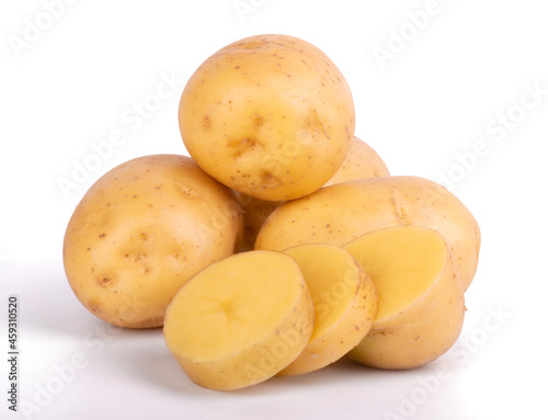 Group of whole and sliced raw potatoes isolated on white background close up