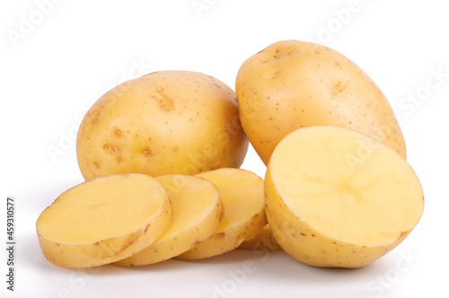 Group of whole and sliced raw potatoes isolated on white background close up