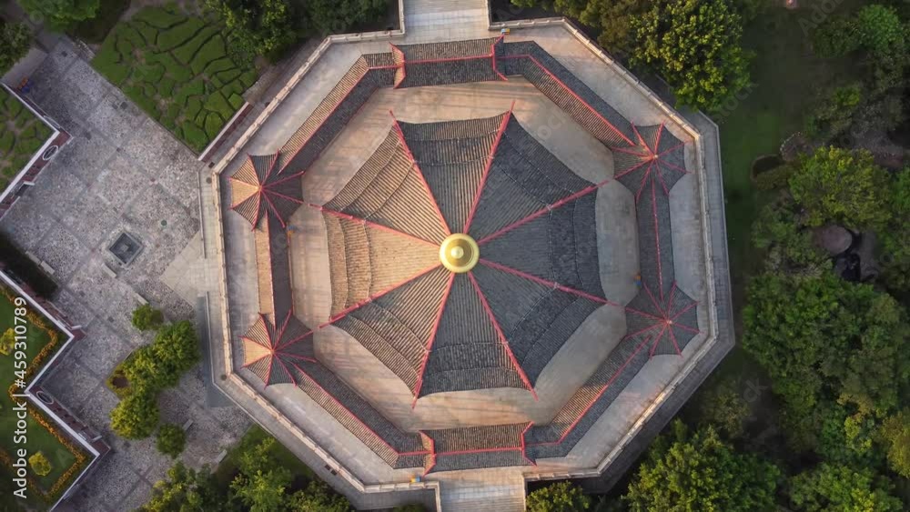 Drone view of pagoda with the characteristic Chinese architecture and modern city in the background