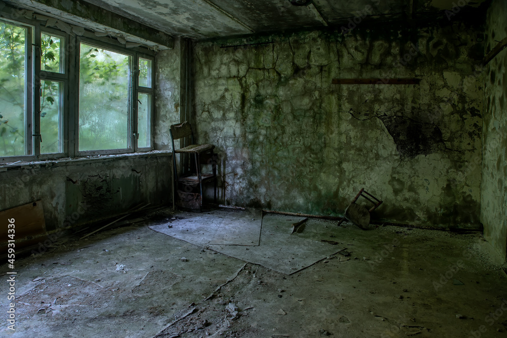 An old abandoned room in the building. Scary abandoned building. Shabby walls. Broken windows. Trees in the street. House with the ghosts. An old abandoned room in the building. Scary abandoned building. Shabby walls. Broken windows. Trees in the street. House with the ghosts.