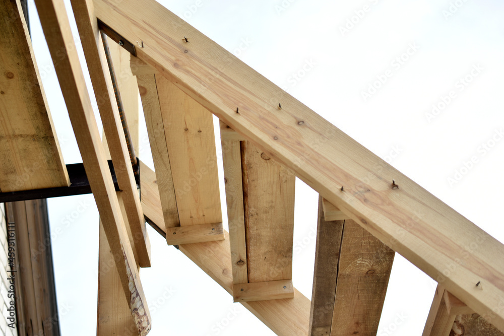 Wooden staircase at the garden house in flowers Wooden staircase at the garden house in flowers