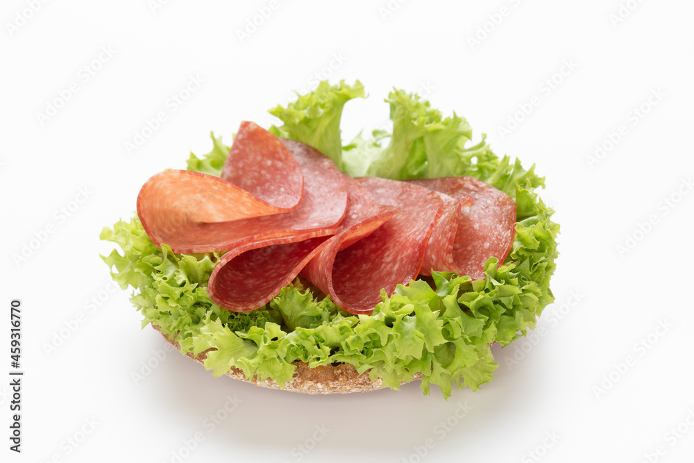 Sandwich with salami sausage on white background. Sandwich with salami sausage on white background.