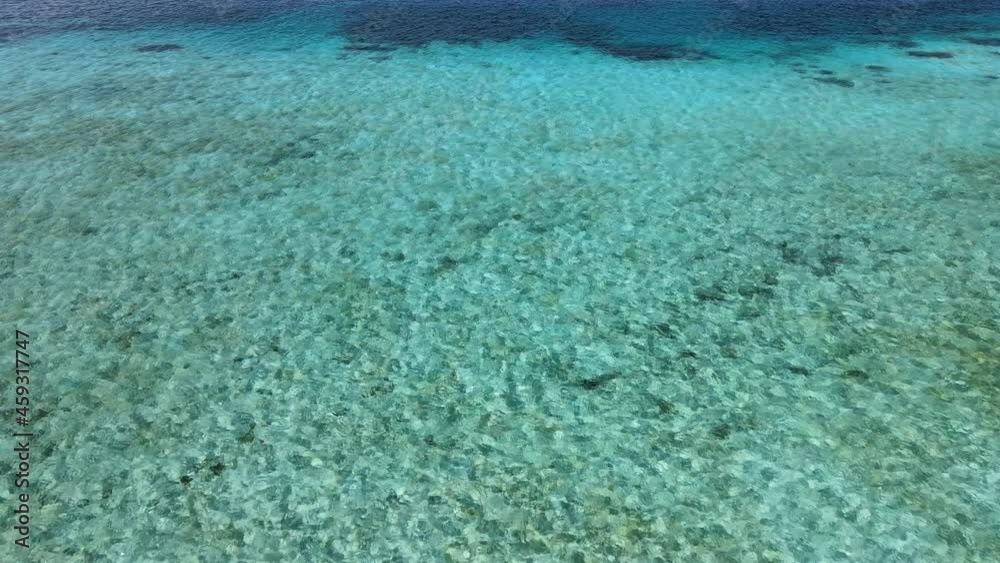 Calm water ripples on the surface of transparent turquoise water. Drone tilt down view. Calm water ripples on the surface of transparent turquoise water. Drone tilt down view.