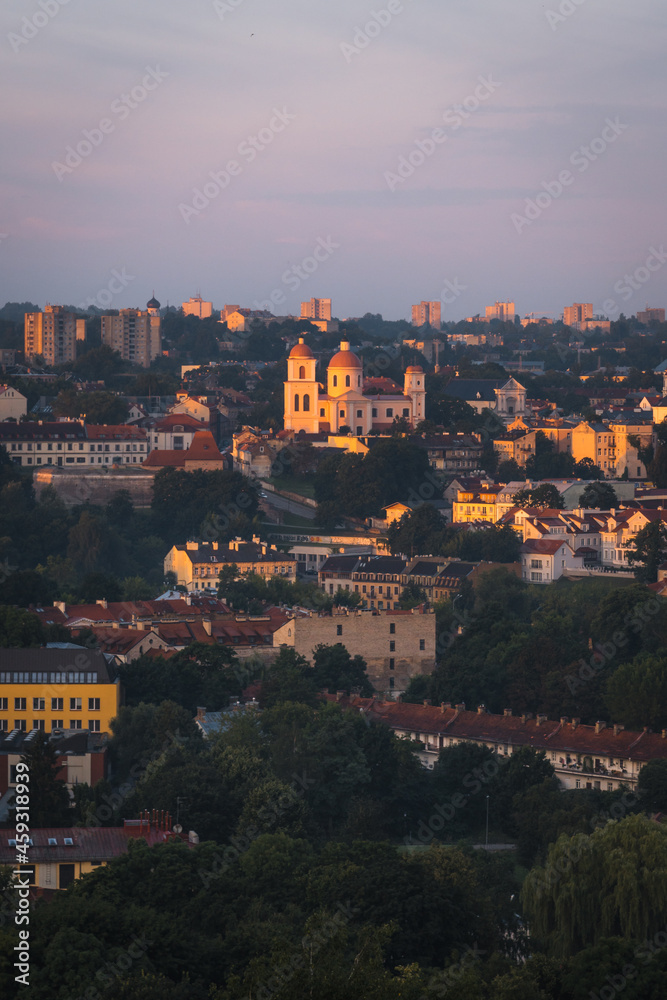VIlnius / Lithuania - August 12 2021: View over the Old Town of Vilnius in summer at sunsetsunrise, amazing baltic touristic city in Lithuania, Europe