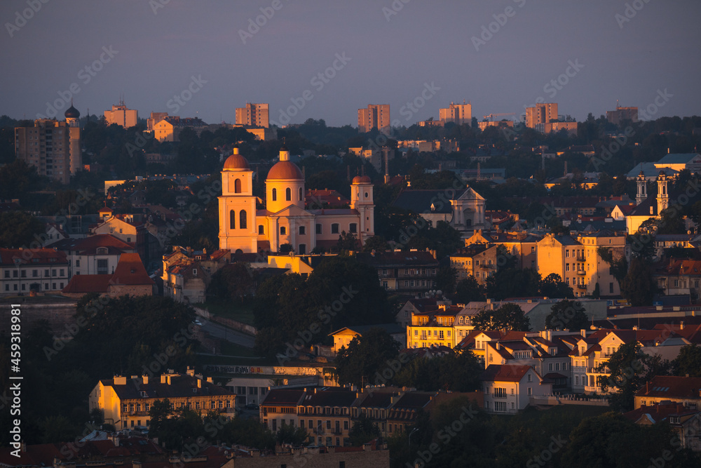 VIlnius / Lithuania - August 12 2021: View over the Old Town of Vilnius in summer at sunrise, amazing baltic touristic city in Lithuania, Europe