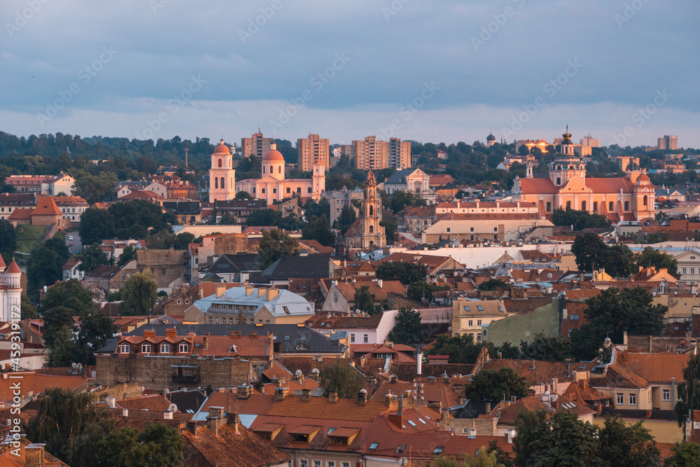 VIlnius / Lithuania - August 12 2021: View over the Old Town of Vilnius in summer at sunset, amazing baltic touristic city in Lithuania