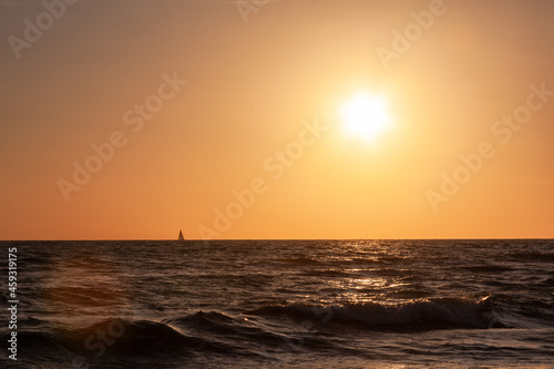 Italian sunset with a sailboat