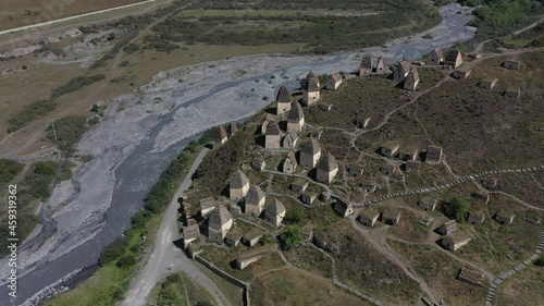 Aerial view of the famous necropolis, located in North Ossetia (Russia), alongside the mountain river 
