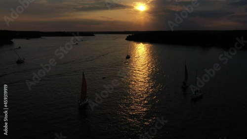 sunset over the river with the ships, aerial view  in the summer 