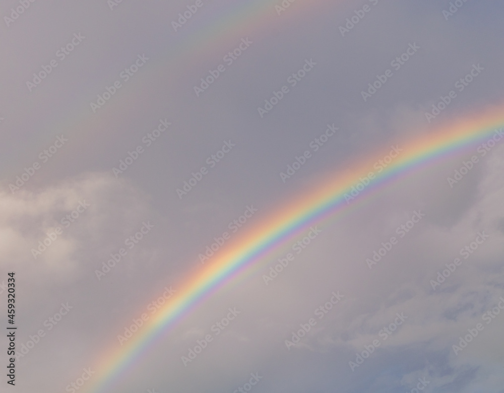A double rainbow during sunset high resolution