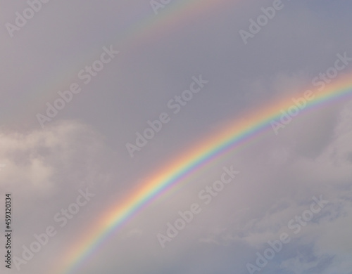 A double rainbow during sunset high resolution