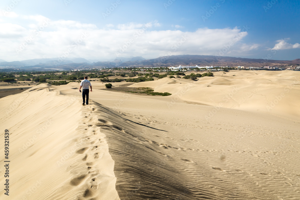 Blue sky and sand dunes with footprints. Blue sky and sand dunes with footprints.