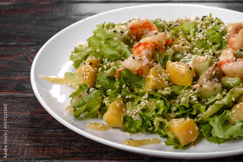 Delicious fresh salad with shrimp and pear for the festive table Delicious fresh salad with shrimp and pear for the festive table