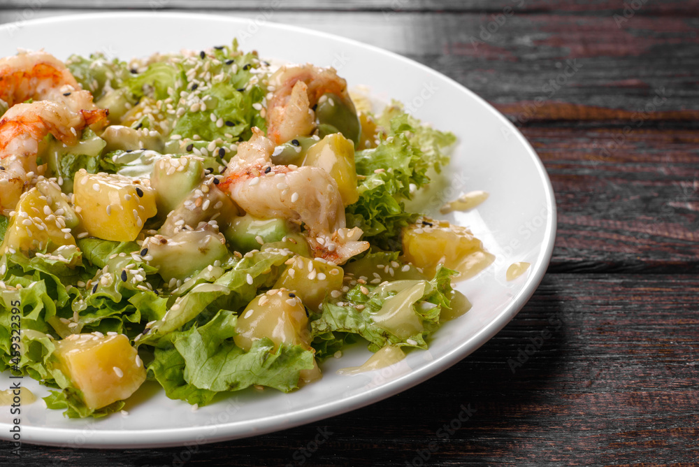 Delicious fresh salad with shrimp and pear for the festive table Delicious fresh salad with shrimp and pear for the festive table
