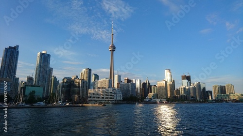 Photo of Toronto Island and Toronto skyline as seen from Toronto Island at day and night. 
