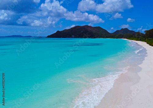 A gorgeous advertising view of the ocean coastline. Seychelles with white sand and blue lagoon