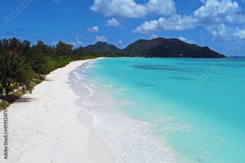 A gorgeous advertising view of the ocean coastline. Seychelles with white sand and blue lagoon © Payllik