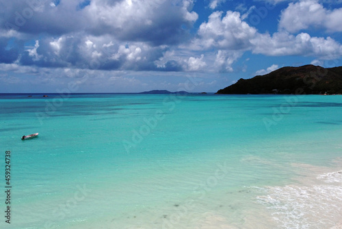 A gorgeous advertising view of the ocean coastline. Seychelles with white sand and blue lagoon