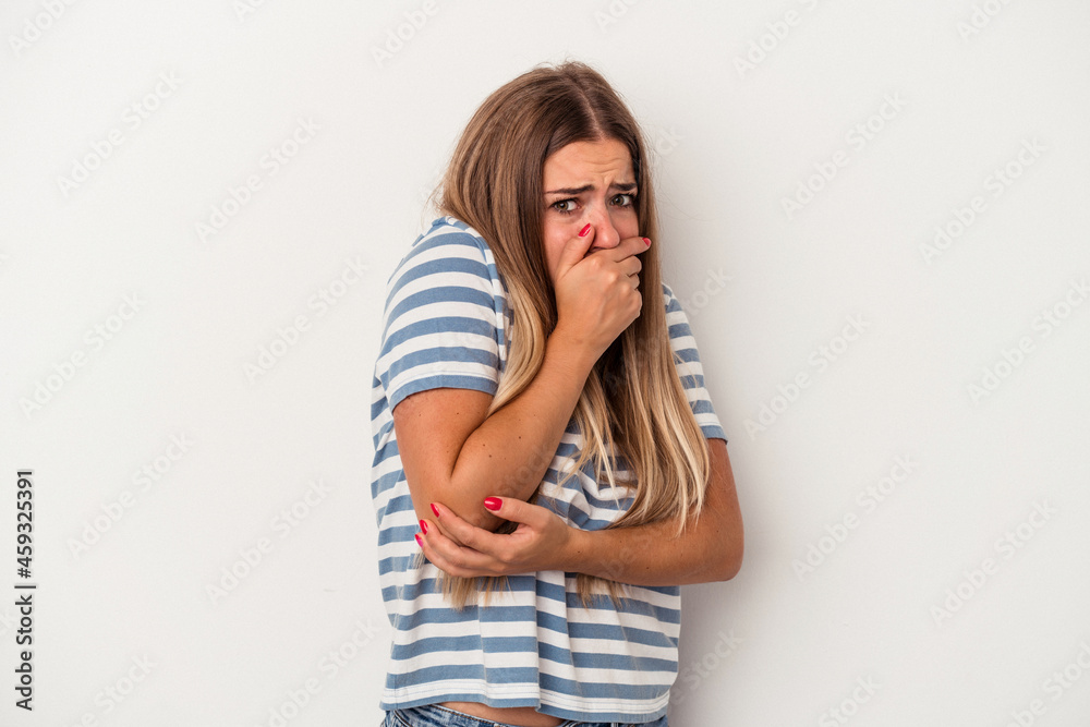 Young Russian woman isolated on white background stretching arms, relaxed position. Young Russian woman isolated on white background stretching arms, relaxed position.