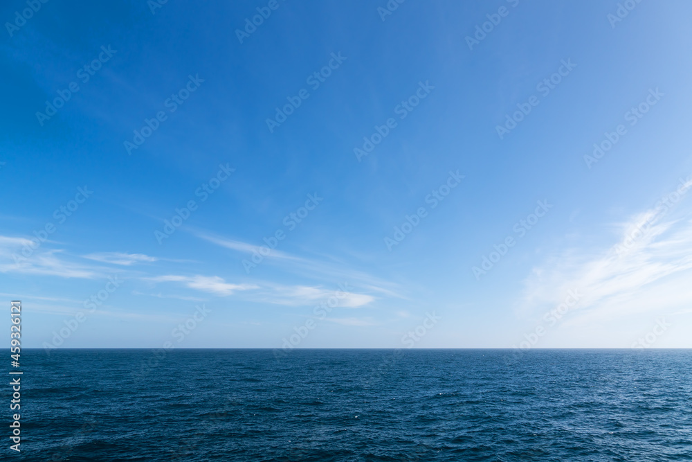 Seascape. Blue sky and white cloud.