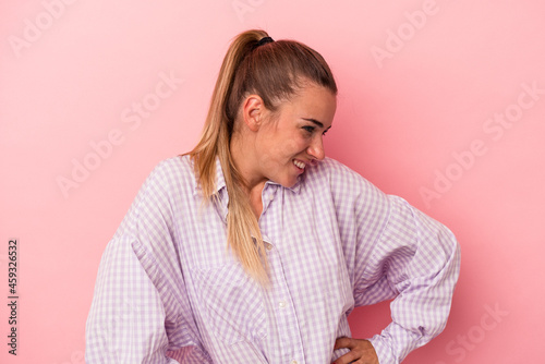 Young Russian woman isolated on pink background feeling energetic and comfortable, rubbing hands confident.