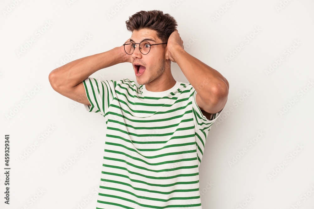 Young caucasian man isolated on white background screaming, very excited, passionate, satisfied with something. Young caucasian man isolated on white background screaming, very excited, passionate, satisfied with something.