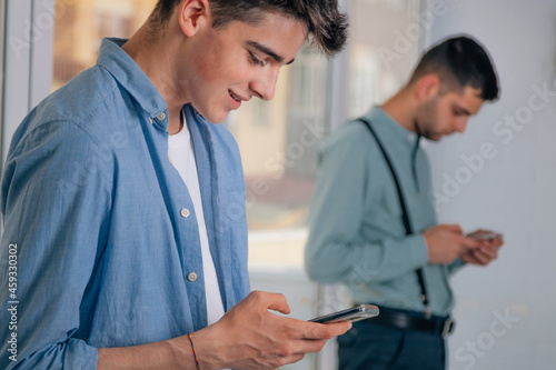 young people looking at the mobile phone