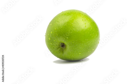 Fresh green apple with water drops isolated on white background with shadow.