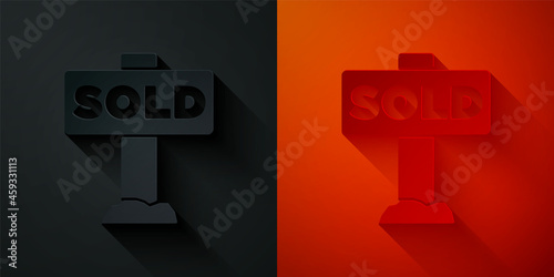 Paper cut Hanging sign with text Sold icon isolated on black and red background. Sold sticker. Sold signboard. Paper art style. Vector