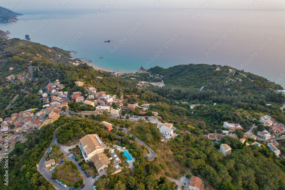 Obraz premium Sunset over coast of Corfu with Pelekas village, Greece.