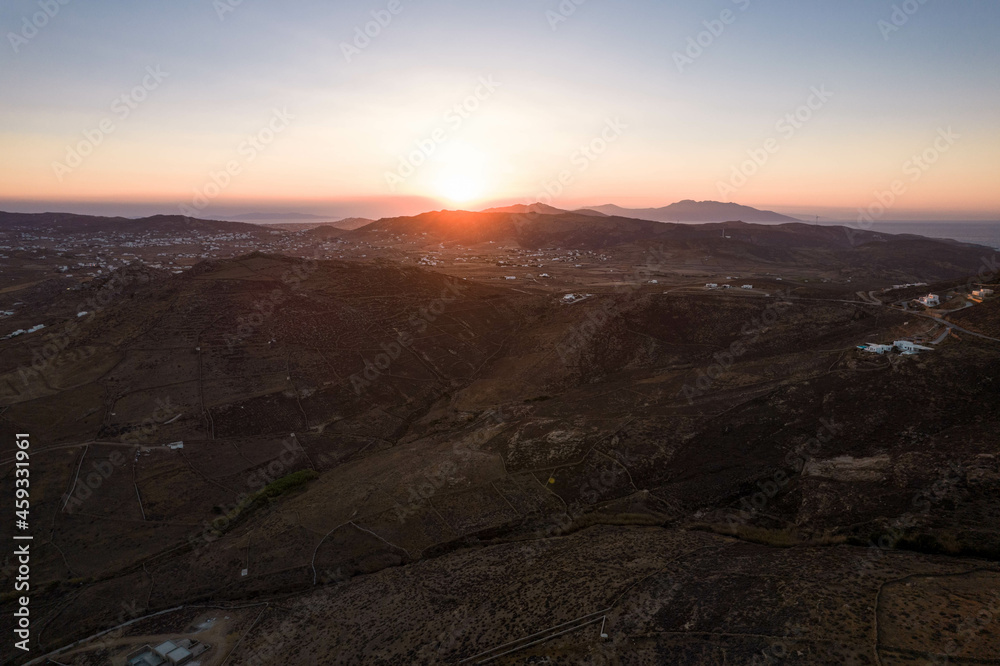 Aerial View of Sun Setting on the Horizon in Mykonos Greece Aerial View of Sun Setting on the Horizon in Mykonos Greece