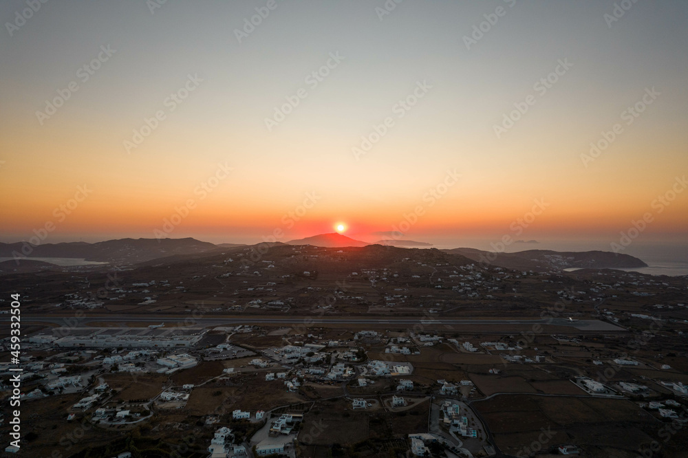 Aerial View of Sun Setting on the Horizon in Mykonos Greece