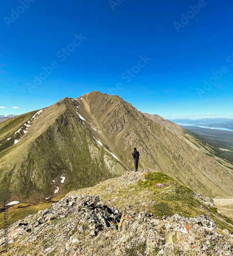 hiker on the top of mountain