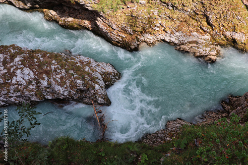 Top View of Powerful Leutascher Ache River between Austria and Germany during Summer. Top-Down of Flowing Water in Nature. photo