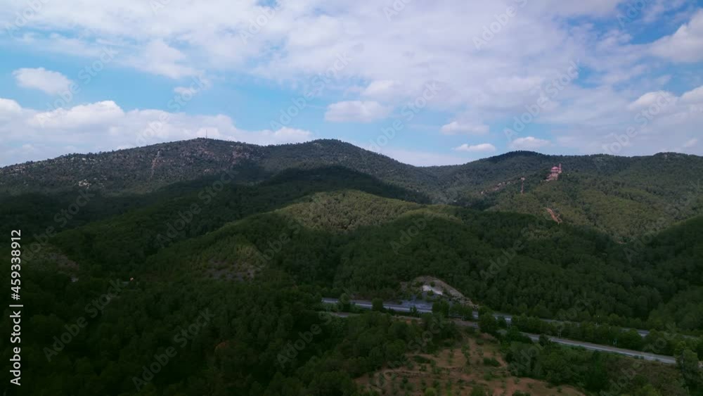 flight over the forest towards high beautiful mountains on a sunny day flight over the forest towards high beautiful mountains on a sunny day