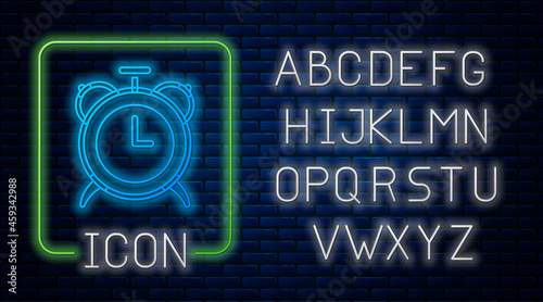 Glowing neon Alarm clock icon isolated on brick wall background. Wake up, get up concept. Time sign. Neon light alphabet. Vector