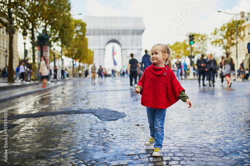Happy preschooler girl walking in Champs-Elysees in Paris, France © Ekaterina Pokrovsky