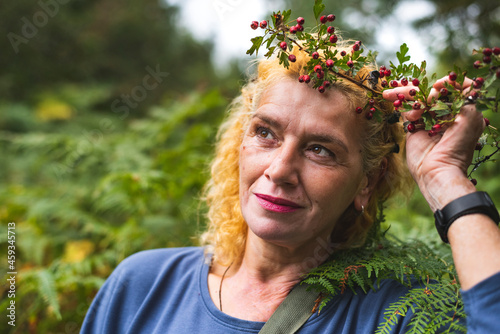 Woman with vitiligo standing in fern field