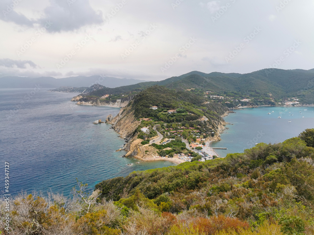 Aerial view of the northern little peninsula in Elba island seen from the top of Monte Enfola, typical mediterranean vegetation and rocky landscape Aerial view of the northern little peninsula in Elba island seen from the top of Monte Enfola, typical mediterranean vegetation and rocky landscape